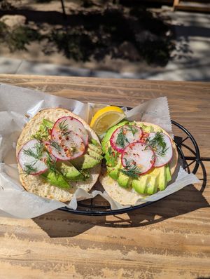 Cali on rosemary sea salt bagel at Raven Hill Bagels in Idyllwild