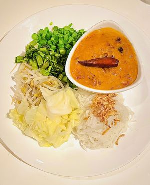 Small portions vermicelli with lots of mung bean coconut curry peanut sauce with a hair on my plate. 🥴  at Satdha Plant Based Thai Kitchen in Santa Monica