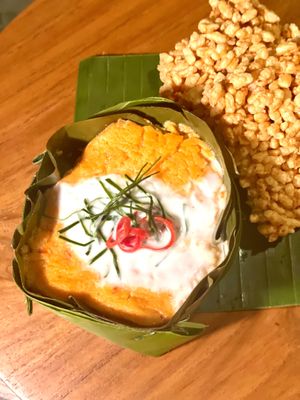 Valentine's Menu 2024. Hor Mok, – Red Lentil Curry Quiche entree’, delicately steamed in a Banana Leaf mold, with a base of cabbage leaf, oyster mushroom and Thai Basil.  at Satdha Plant Based Thai Kitchen in Santa Monica