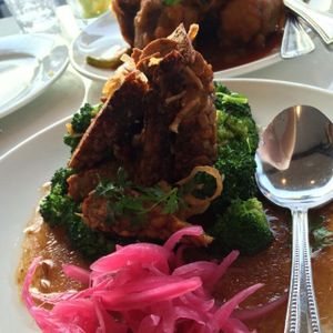 SUPER SAVORY SHALLOT BROCCOLI AND TEMPEH at Satdha Plant Based Thai Kitchen in Santa Monica