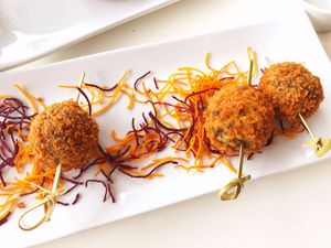 Mung Bean Croquette: mung bean and mushroom thai meatball with sweet toasted chili-cilantro sauce at Satdha Plant Based Thai Kitchen in Santa Monica