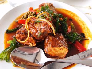 Catfish Eggplant: Battered eggplant wiht red curry paste, bell peppers, young pepper corn and Thai basil at Satdha Plant Based Thai Kitchen in Santa Monica