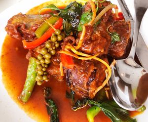 Catfish Eggplant: Battered eggplant wiht red curry paste, bell peppers, young pepper corn and Thai basil at Satdha Plant Based Thai Kitchen in Santa Monica