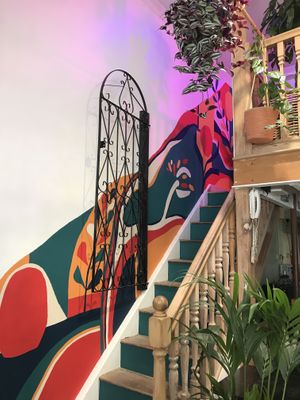 Microbrewery stairs leading to the mezzanine space and where the fermentation jars live.  at Wild IS Earth in North West London