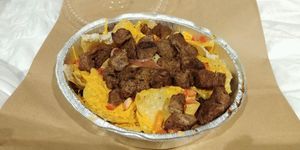 To go order of vegan nachos with seitan at Bueno Loco Restaurante in Falmouth