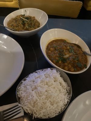 Chana Masala (foreground) and Baigan Ka Bharta (background) with boiled rice to sharee  at Himalayan Monal  in Preston