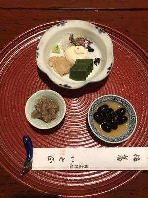 Appetizers: black beans, some kind of veggie with miso, and a plate with tofu, gelified green tea, daikon, cucumber, and some other lovely things! at Itosho in Tokyo