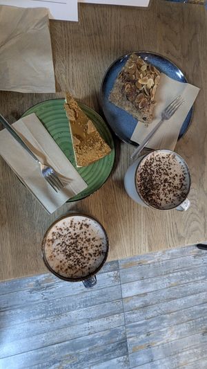 Spiced apple cake, Biscoff cheesecake and oat milk hot chocolate. All vegan at Aris Healthy Life in Exeter