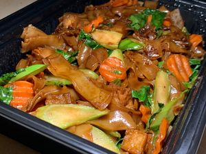 Pad See Yew (To Go): Wide Rice Noodles w/ Broccoli, Carrots, Onions, Basil in a Sweet, Savory Sauce at Thai Table in Grand Rapids