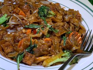 Pad Kee Mao (Drunken Noodle): Wide Rice Noodles w/ Tofu, Broccoli, Carrots, Onions, Basil in Soy-Based Chili Sauce at Thai Table in Grand Rapids