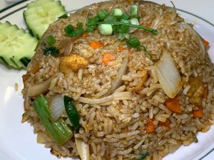 Tom Yum Fried Rice: Tofu, Lemongrass, Carrots, Onions, Scallions, Bean Sprouts, Kaffir Lime Leaves, Thai Basil in signature Tangy-Spicy Sauce at Thai Table in Grand Rapids