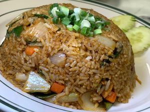 Tom Yum Fried Rice: Tofu, Lemongrass, Carrots, Onions, Scallions, Bean Sprouts, Kaffir Lime Leaves, Thai Basil in Tangy-Spicy Sauce at Thai Table in Grand Rapids