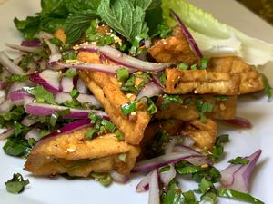 Larb Tofu: Fried Tofu w/ Red Onions, Scallions, Cilantro, Mint, Lime Juice, Chili Powder, Ground Roasted Rice at Thai Table in Grand Rapids