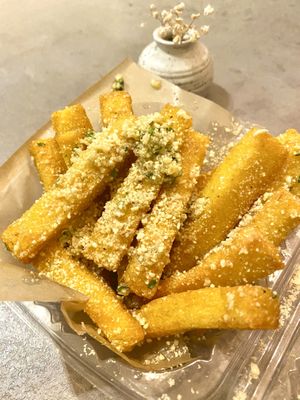 Polenta fries smothered in garlic  at Ittle Litaly in Coral Gables