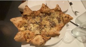 bianca star pizza is delicious: roasted garlic, carmelized onions and i love the texture of the cheese-filled crust adds so much pleasure!!  at Ittle Litaly in Coral Gables