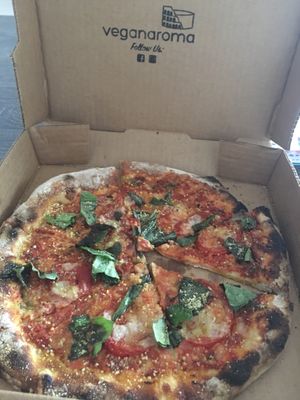 Margherita Pizza To Go | Cashew mozzarella, plum tomato sauce, basil, almond parmesan. at Ittle Litaly in Coral Gables