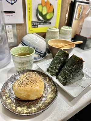 Tea, tofu soup, grilled miso onigiri, natto and peanut miso onigiri  at Onigiri Gorichan in Osaka