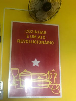 Sign in the restaurant -- Cooking is a revolutionary act.  at Rango Vegan in Salvador