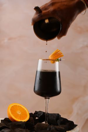 Orange Owl: A signature mocktail made from edible charcoal and fresh orange  at Phurr in Bangalore