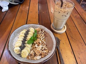 Latte with almond milk, smoothie bowl with banana cocoa and peanut butterr  at Nature House Restaurant in Koh Lanta