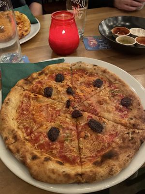 Sourdough pizza with kimchi, vegan cheese and kalamata olives  at Brewpub De Kromme Haring in Utrecht