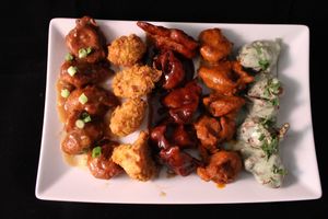vegan Chik'n Wings: Crispy Battered vegan Wings tossed in a variety of sauces (L-R: Soy Garlic, No Sauce, Cumin BBQ, Buffalo, Creamy Mint) at Bombay Food Junkies in St Louis