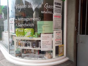 Posters downplaying covid-19 at Tofulino in Winterthur