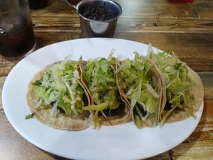 Vegan tacos with extra beans (back) at A Catriña  in A Coruna