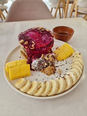 Yummy pancakes that didn't taste sweet (thankfully!) I was clumsy as I turned the plate, they placed the cream beautifully on top 😉 at KURUMI - Healthy Vegan Food & Desserts in Hoi An