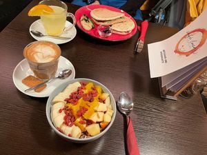 Soy yoghurt with granola and fruits and panini with grilled vegetables  at Cafe Luca's in Immenstadt