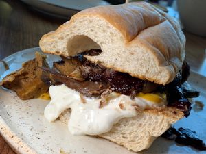 Seitan n Cheeze: House-Made Seitan "Beef", Beer Cheeze, Crispy Onions, Blueberry BBQ Sauce, Horsey Mayo, Hoagie Bun. (GR Vegan Chef Challenge 9/25) at The Sovengard in Grand Rapids
