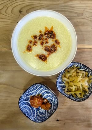 Millet porridge with chilli oil, fermented tofu, and pickles at Bao and Congee Shop - 众善缘包粥铺 in Dali