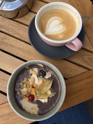 Small Acai bowl with peanut butter and a decaf oat milk cappuccino at Otti - Das Vorstadt Café in Vienna
