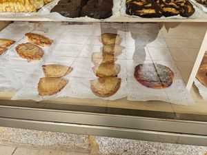 2 vegan options, 1 empanada and a small vegan pizza at Panaderia As Maroñas in A Coruna