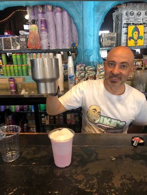 Ike, the owner, mixing magic elixirs  at Ike's in New Orleans