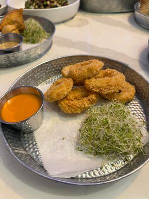 Fried Calamari served with tangy ketchup and mayo sauce. at Botbar Vegan Cafe in Brooklyn