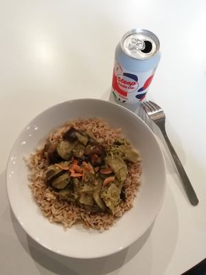 Thai green curry on a bed of brown basmati topped with toasted almond, Steep Soda cola at Sidney Street Cafe in Manchester