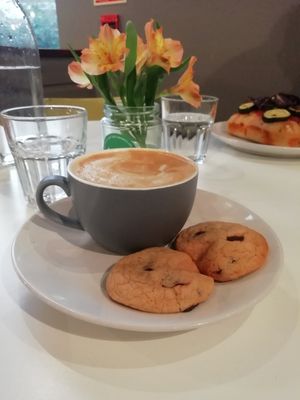 Oat latte and chocolate chip cookies at Sidney Street Cafe in Manchester