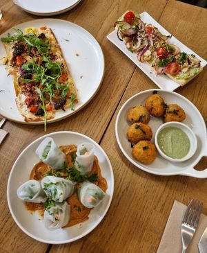 Various tapas: Flammkuchen, spring rolls, bruschetta, croquettes at Kosmopoliet in Bruges