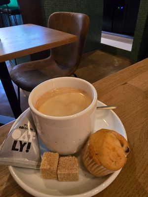 Coffee , comes with oatly at Kosmopoliet in Bruges