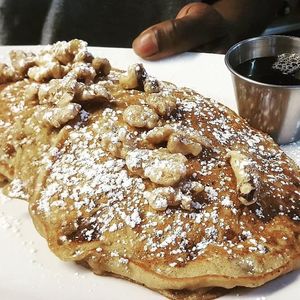 Banana Walnut Pancakes. Four pancakes with caramelized walnuts and fresh fruit. Vegan. at Brooklyn Street Local in Detroit