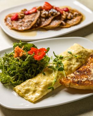 Mushroom and Swiss Omelette with mixed green salad and sourdough toast. Vegetarian. at Brooklyn Street Local in Detroit