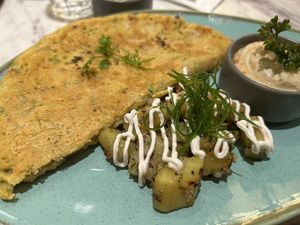 Omelette with hummus and potatoes   at Earth Cafe @ Churchgate in Mumbai