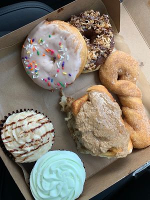Key lime, caramel bourbon cupcakes. Double cinnamon bun, cinnamon twist, strawberry and Samoa dough.  at Glory Doughnuts & Diner in Frederick