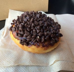 Darth Vader doughnut: mini chocolate chips on top with vanilla creme inside at Glory Doughnuts & Diner in Frederick