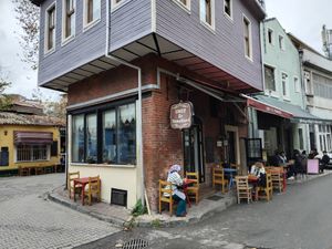 The place isn't big with some tables inside and surrounding the building outside. at Umut Ev Yemekleri in Istanbul