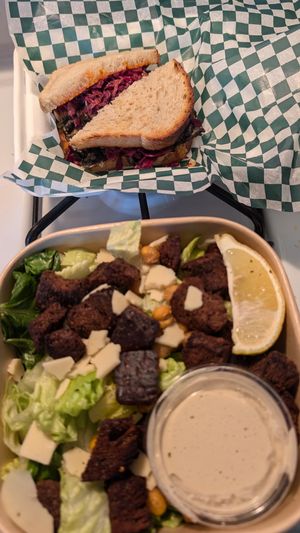 Ruby Reuben Revival Sandwich 
Chickpea Caesar Salad  at The Conscious Cafe in Lethbridge