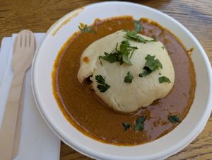 Fufu mit Mafé, ein Hefekloß mit dicker Erdnusssauce und Gemüseeinlage at Kilimanjaro African Food in Dortmund