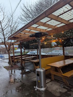 Covered, heating lamp outside at Lazy Days Brewing Co in Portland