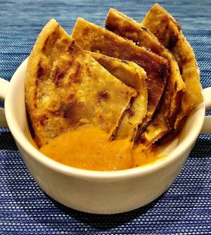 Aloo paratha with tomato chutney  at L'APERO in Dubai